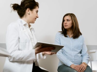 Pregnant woman is having a consultation with a doctor