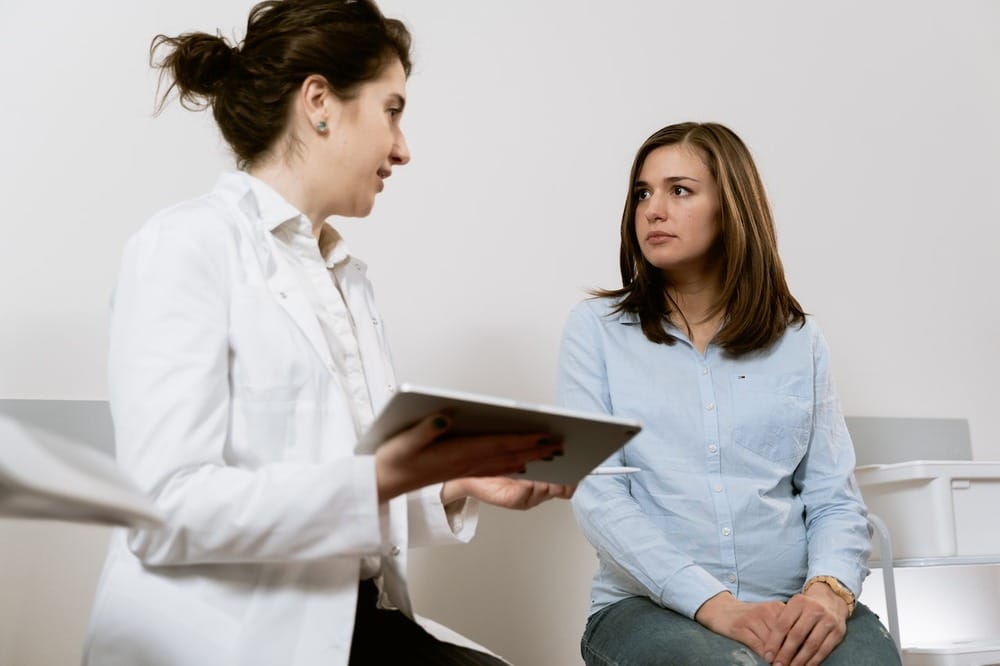Pregnant woman is having a consultation with a doctor